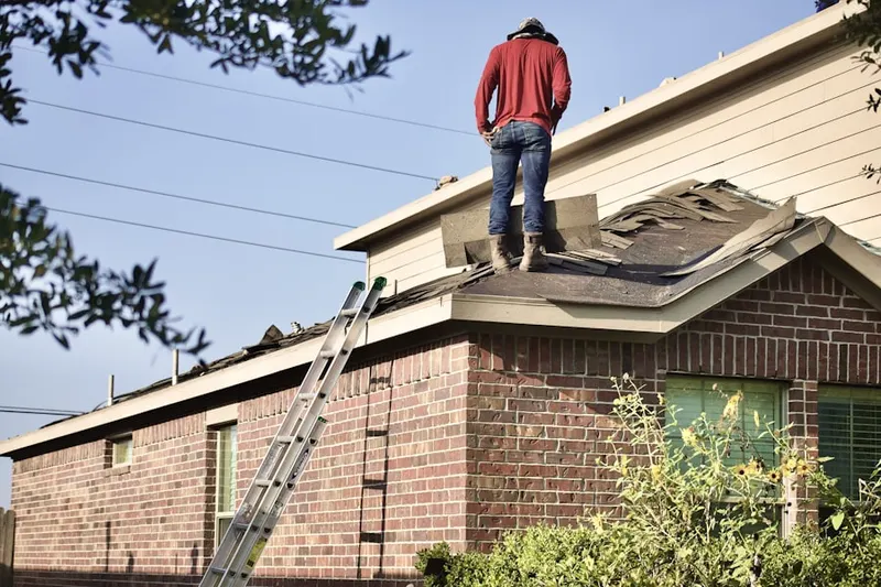Professional roofer working on a residential roof in The Highlands at Anaheim Hills